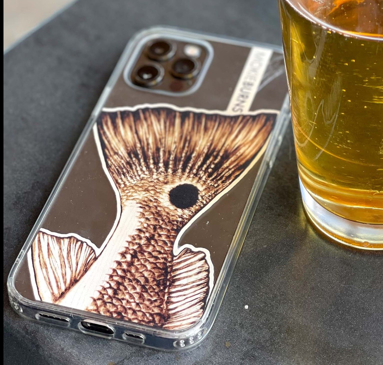 mokie burns inshore fishing redfish tail wood burned artwork, on a clear iphone case for all sizes! Perfect for kids back to school, or your fishing husband or wife. Texas fishing, Florida fishing, Louisiana fishing and South Carolina fishing, this red drum artwork covers it all